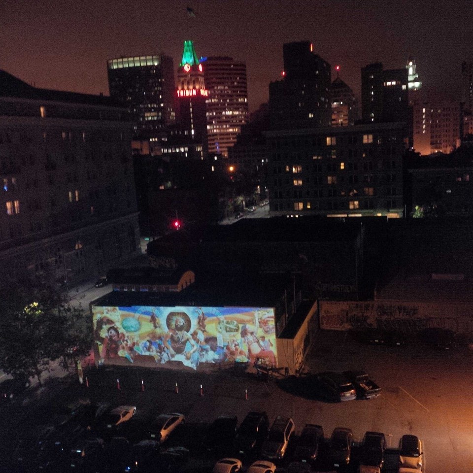 The view of the mural projection from the top of the Malonga Casquelourd Center. Photo by Theo Williams.