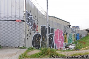 This tagged-out East Oakland wall has become a magnet for illegal dumping