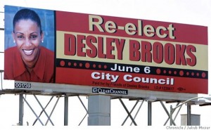 This billboard may be as close as D6 residents come to getting official murals in their district