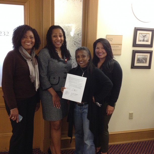 #SupportMalonga Coalition's Carla Service, Bay Development's Gladys Moore and Maria Poncel, and CM Lynnette Gibson-McElhaney hold up the signed mediation agreement